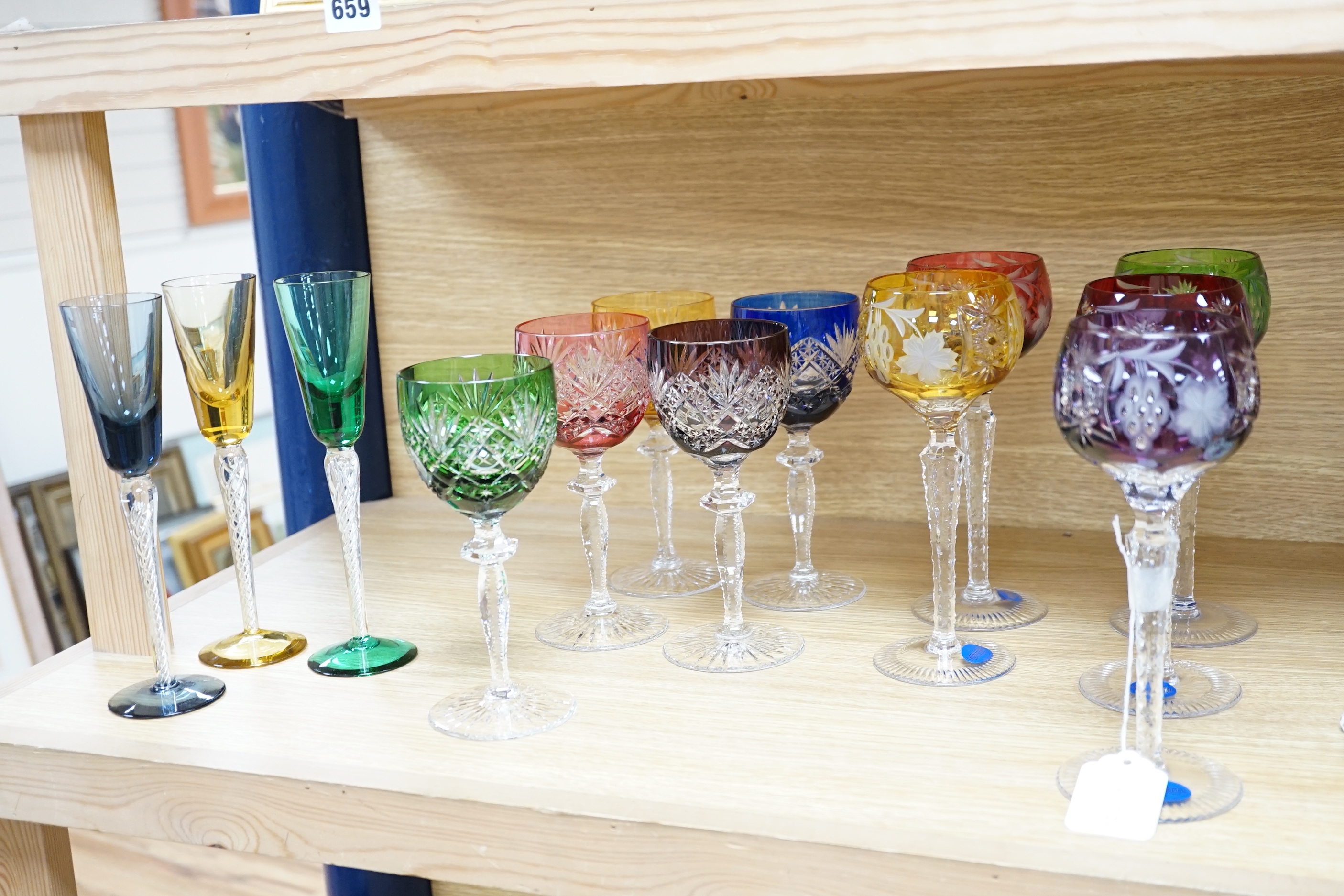 Two sets of six Harlequin colour flashed hock glasses and a set of four air twist glasses